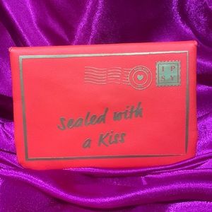 Ipsy cosmetics case. Sealed with a kiss. Red and gold. Postage design